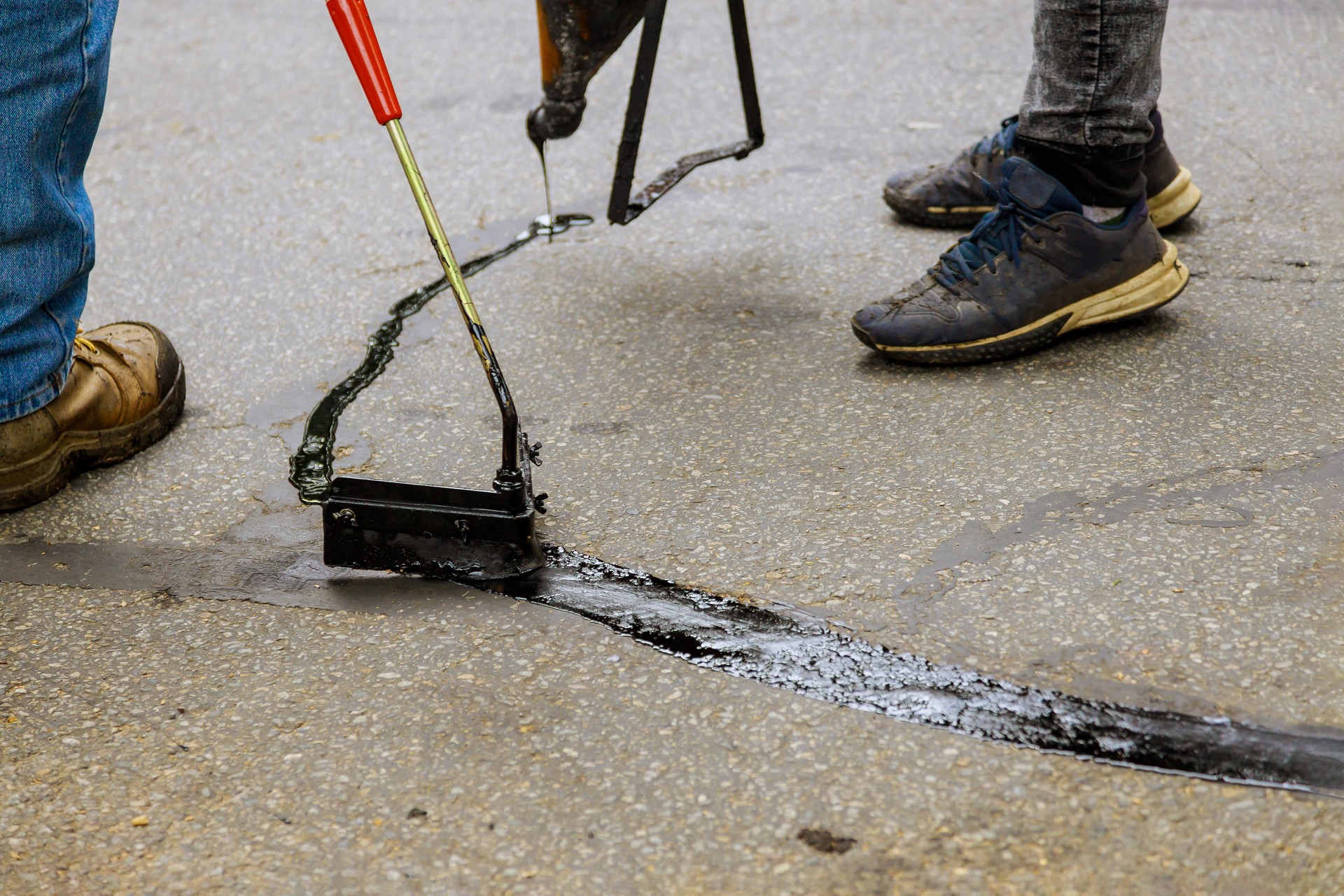 Asphalt road with filled cracks repair, liquid, of the fix road