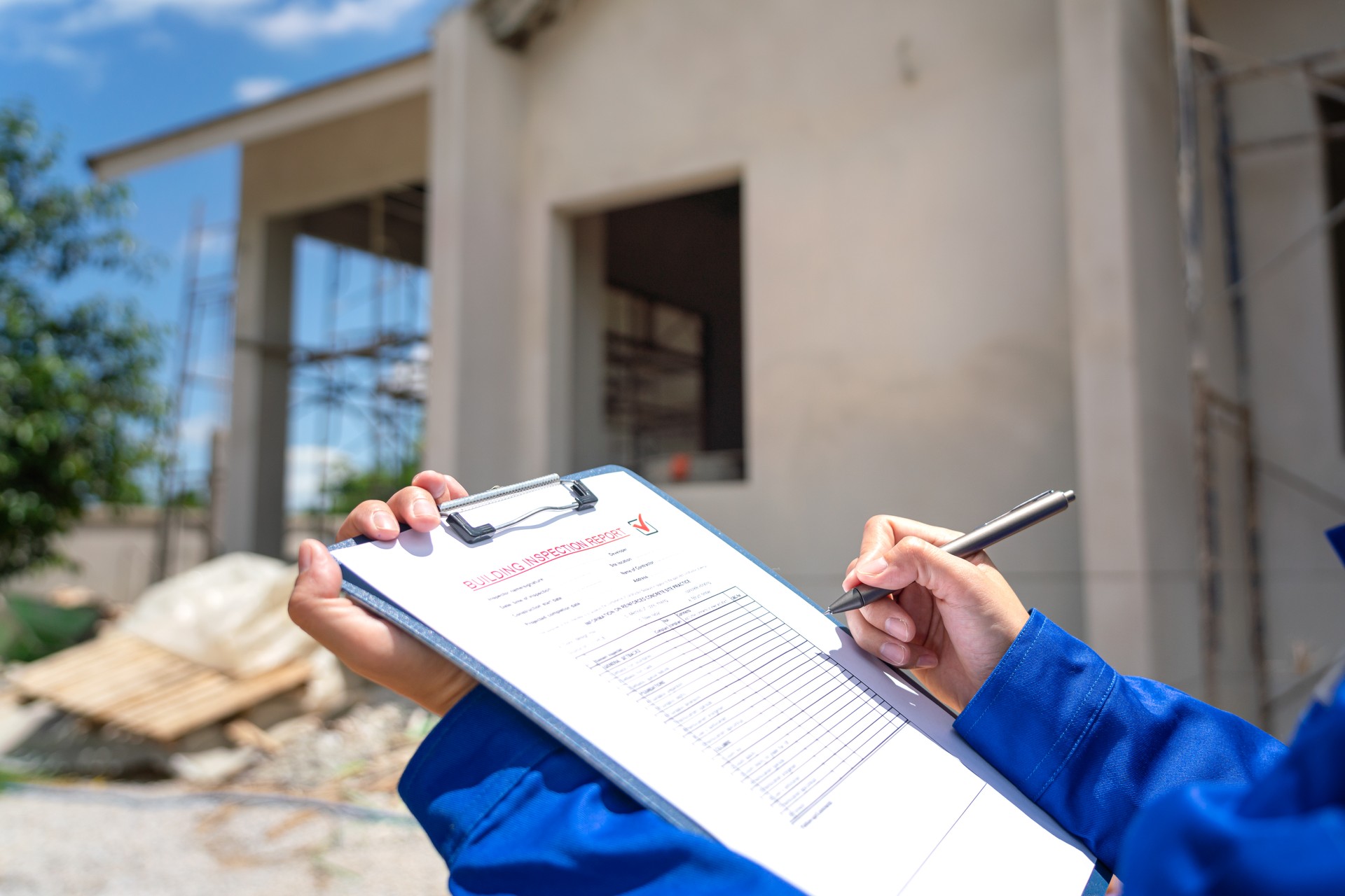 An architect is checking on house building quality checklist.